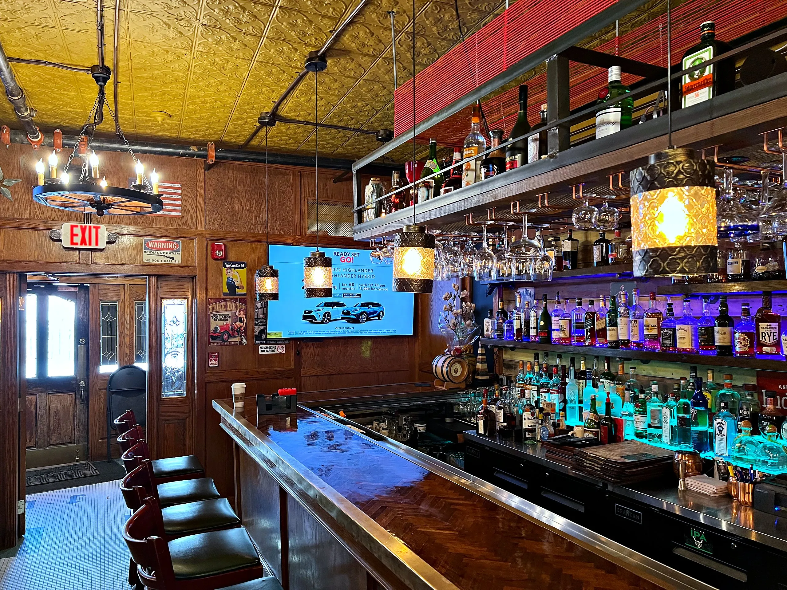 Bar with TVs mounted above the back bar