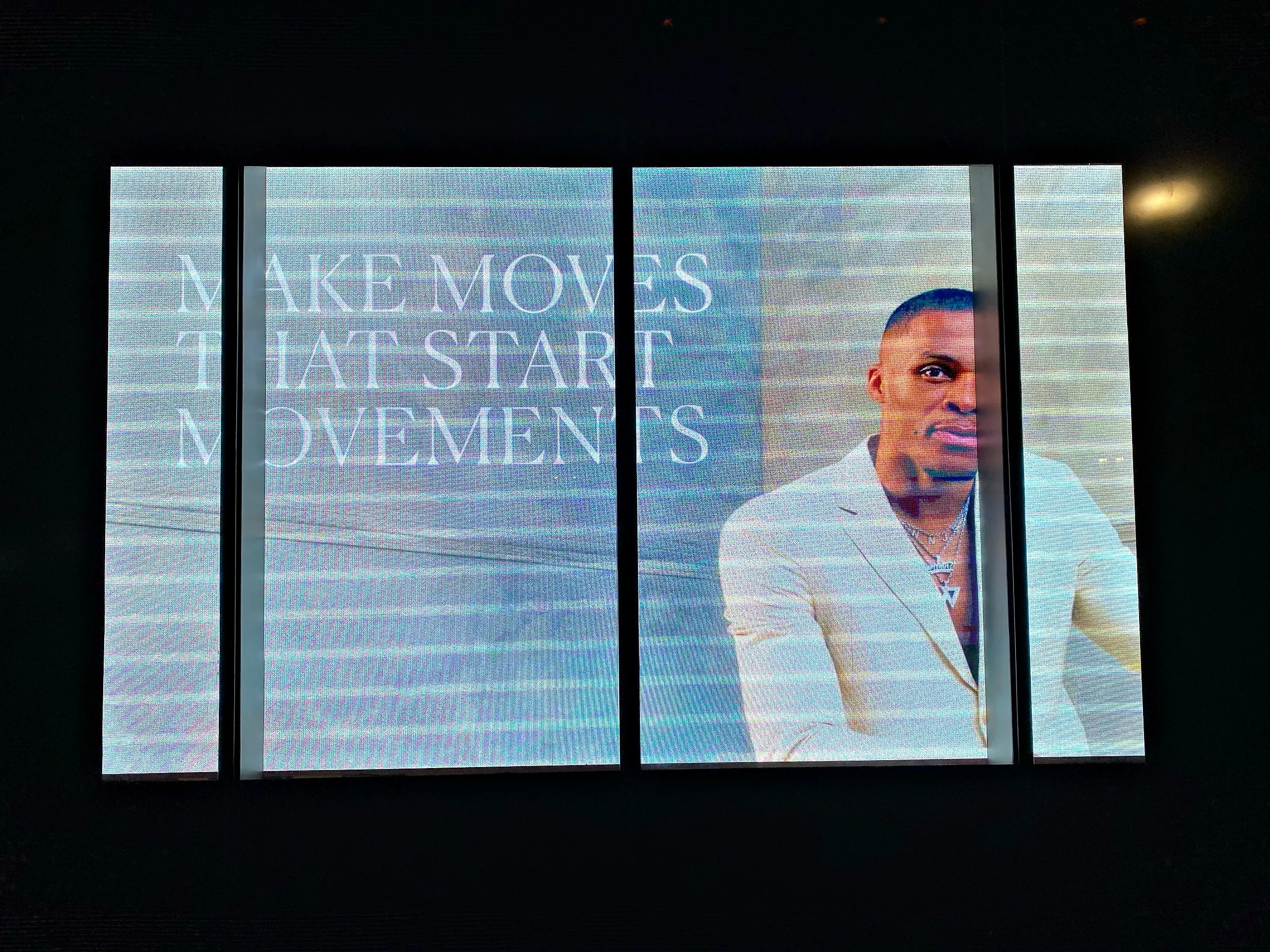 Storefront window displays showing video
